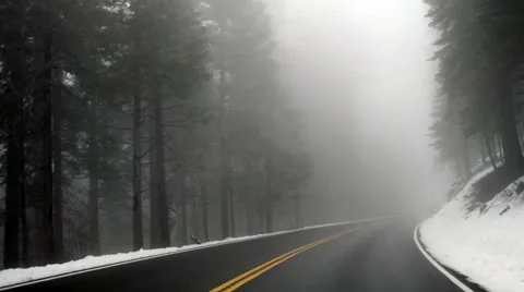 Driving through Mountain Snow and Fog Stock Footage 36033502