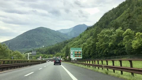 Driving through mountains on a cloudy day. Stock Footage 133256475