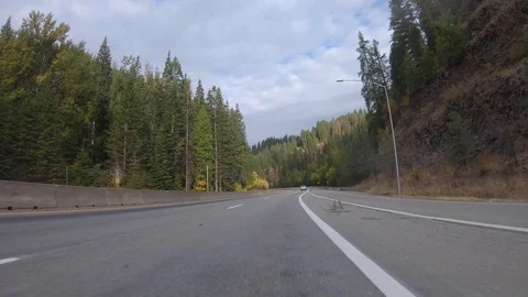 Driving through the mountains on a crisp fall day in the Idaho panhandle Stock-Footage 96765619
