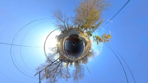 Driving through neighborhood houses in springtime, tiny planet perspective Video stock 128311341
