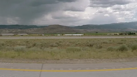 Driving through Nevada desert, storm clouds looming. Stock Footage 95163772