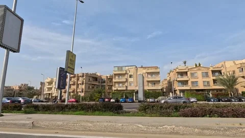Driving Through Open Streets New Cairo Showing Modern Buildings Traffic And Stock Footage 329777332