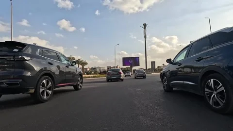 Driving Through Peaceful Streets New Cairo Showing Modern Buildings Traffic And Stock Footage 329656647