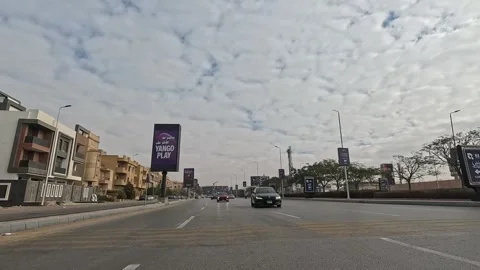 Driving Through Peaceful Streets New Cairo Showing Modern Buildings Traffic And Stock Footage 329735840