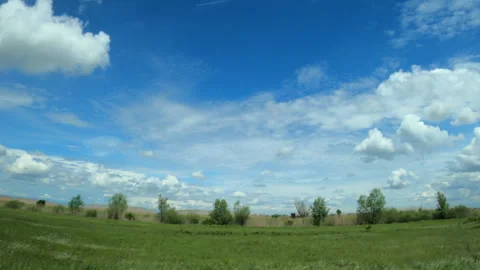 Driving through plain landscape countryside, side view from the car Video stock 154416923
