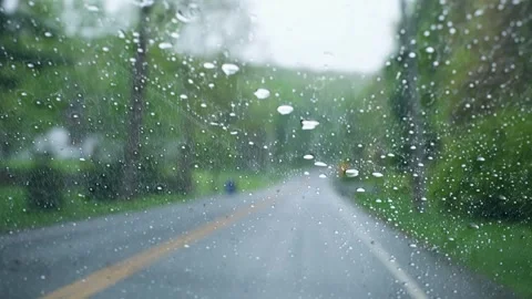Driving through rain on a rural highway with active windshield wipers. Stock Footage 334263910