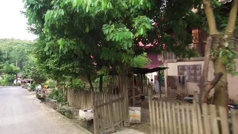 Driving through remote Village in Laos Stock Footage 131923898