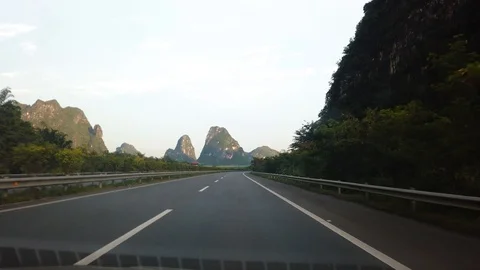 Driving through rice fields and karst rocks in Guangxi province, China Stock Footage 114811588