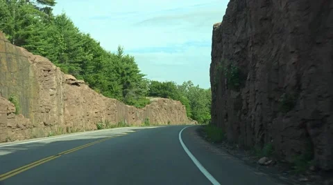 Driving through a rock cut Stock Footage 52527232