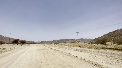 Driving Through a Rugged Desert Mountain Valley Vídeo Stock 327864882
