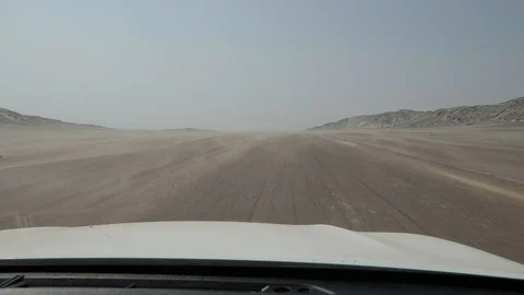 Driving through sand storm along Skeleton Coast National Park, Namibia Video stock 104004791