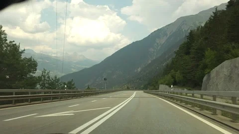 Driving Through Scenic Alpine Valley on Mountain Highway Stock Footage 342752128