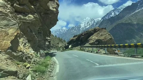 Driving Through Scenic Mountain Road in Leh Ladakh with Snow Peaks Stock Footage 338224408