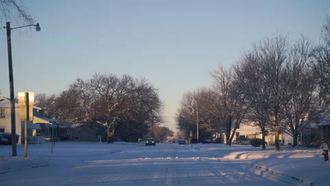 Driving through a Small Snowy Town Vídeo Stock 146678694