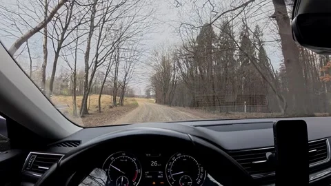 Driving through small town roads and countryside paths in a car during a cloudy 스톡 동영상 345137768
