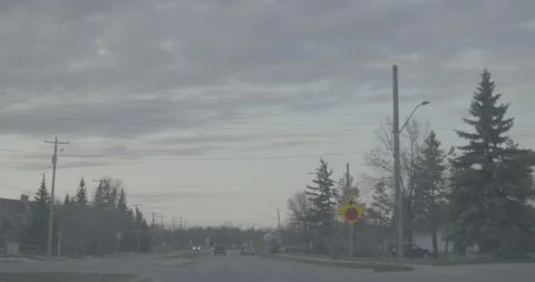 Driving through a small town shortly after sunset Stock Footage 146807703