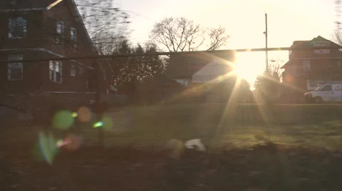 Driving Through Small Urban Town During Sunset Video stock 61045926