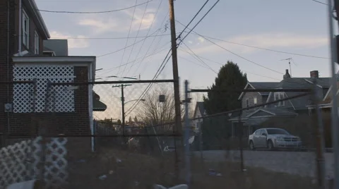 Driving Through Small Urban Town During Sunset Vídeo Stock 61045930