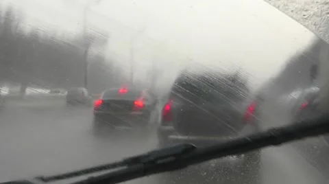 Driving through the snow with activated wipers Vídeos de archivo 59796675