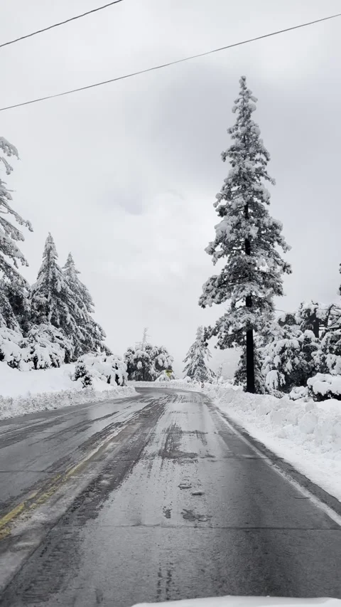 Driving Through Snow Covered Mountain Road Vídeo Stock 263930148