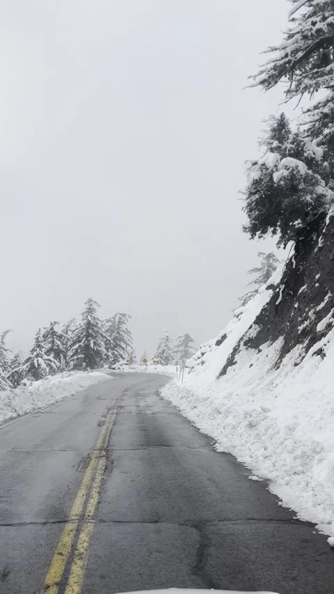 Driving Through Snow Covered Mountain Road Vídeo Stock 263930177
