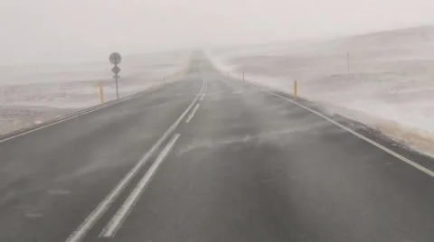 Driving through snowstorm in Iceland Stock Footage 61166657