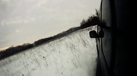 Driving through snowy lowland Stock Footage 14808380