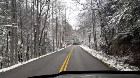Driving through snowy mountains Video stock 122252461