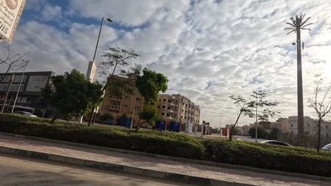 Driving Through Spacious Streets New Cairo Showing Buildings Traffic And Urban Stock Footage 329708618