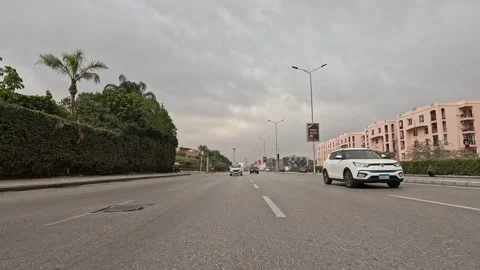 Driving Through Spacious Urban Streets New Cairo Showing Buildings Traffic Stock-Footage 330110502