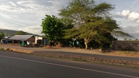 Driving through the streets of the city of Arusha. Sunny day Stock-Footage 169911294