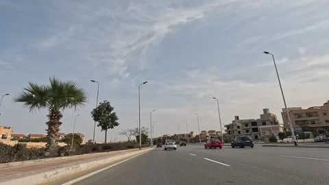 Driving Through Stylish City District Streets New Cairo Showing Buildings Stock-Footage 329758679