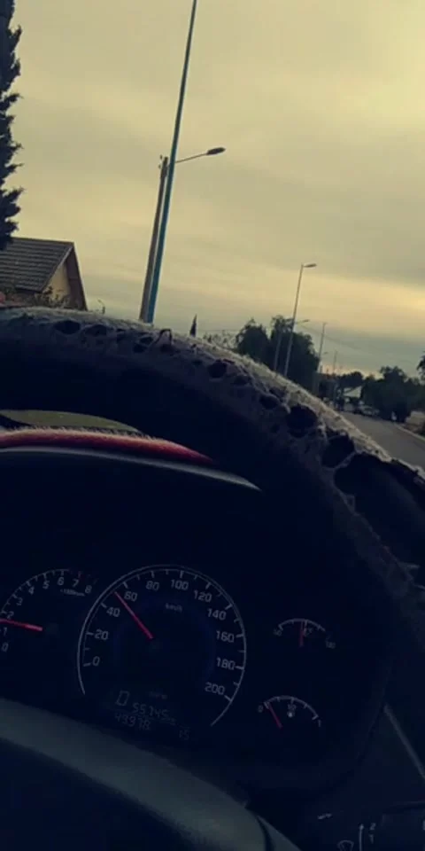 Driving through suburban road under cloudy sky, dashboard view Stock Footage 328564643