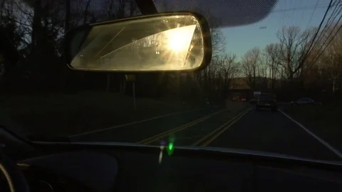 Driving through the suburbs as the sun sets Video stock 77811583
