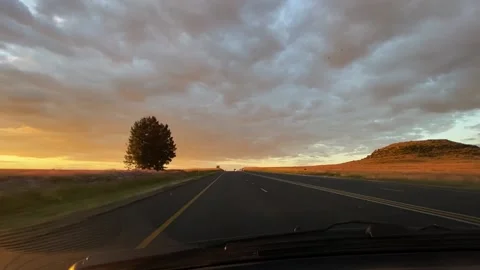 Driving through a sunset Stock Footage 153410972
