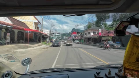 Driving Through Thai Town with Local Shops and Traffic Stock Footage 341367913