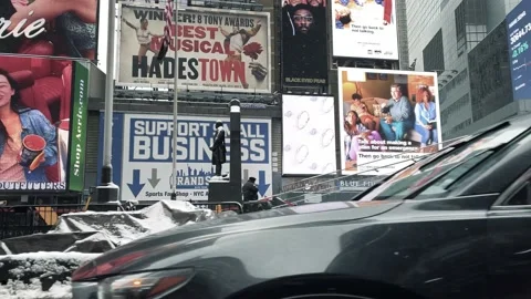 Driving through Times Square stores shops signs winter snowing New York City NYC Stock Footage 149136213