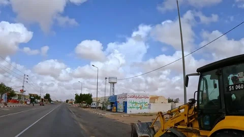 Driving through town with smuggled fuel market. slow motion Stock Footage 280886316