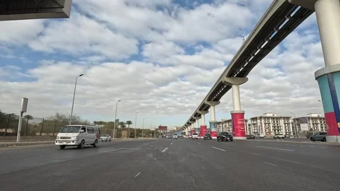 Driving Through Tree Lined Streets New Cairo Showing Buildings Traffic And City Stock Footage 329702359