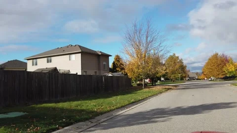 Driving Through Upper Class Neighborhood Corners In Spring Autumn With White Stock Footage 153560961