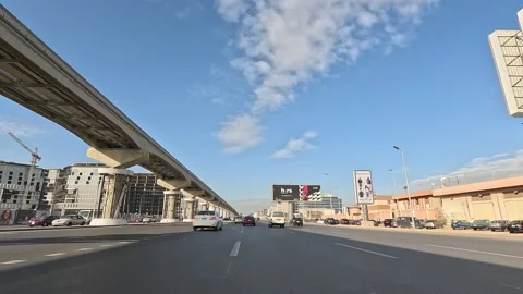 Driving Through Urban Area New Cairo Showing Roads Buildings Traffic And Stock-Footage 329699372