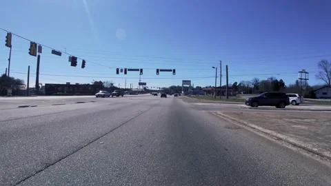 Driving through urban gas stations and buildings on Gordon highway Harvest Ta Stock Footage 149067849