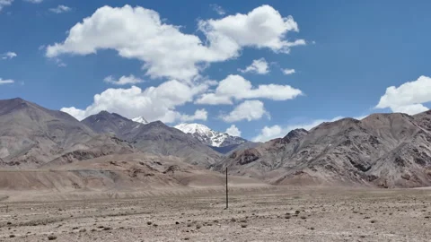 Driving Through Vast Barren Mountains in Xinjiang, China Stock Footage 339628599