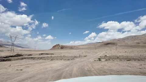 Driving Through Vast Barren Mountains in Xinjiang, China Stock Footage 339630688