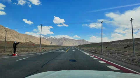 Driving Through Vast Barren Mountains in Xinjiang, China Stock Footage 339657210