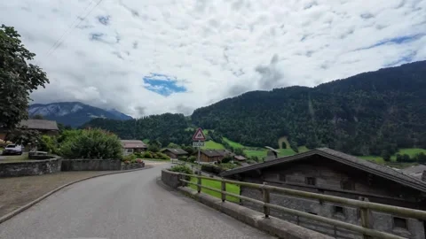 Driving Through Village Intersection with Wooden Houses Stock Footage 340363447