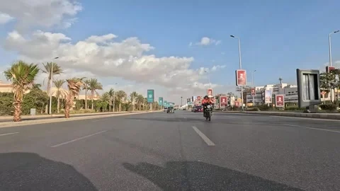 Driving Through Wide Boulevards New Cairo Showing Modern Buildings Traffic And Stock Footage 329660519