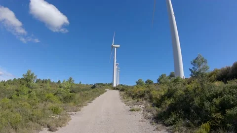 Driving through the windmills road Stockbeeldmateriaal 141440300