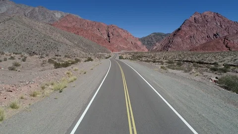 Driving throught road in a valley between colorful eroded mountains 스톡 동영상 97203129