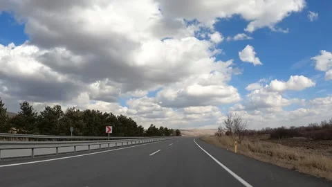 Driving in time lapse on the highway outside the city on a sunny day. Stock Footage 246675788